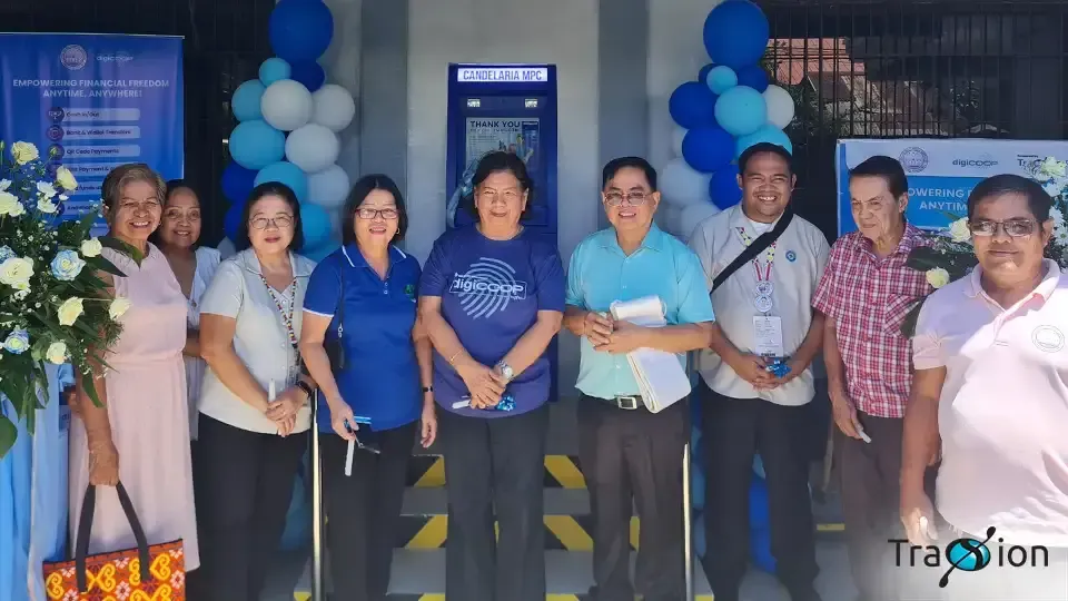 Candelaria Multipurpose Cooperative officers and guests in front of the cooperative's new Cash Teller Machine, decorated with blue and white balloons.