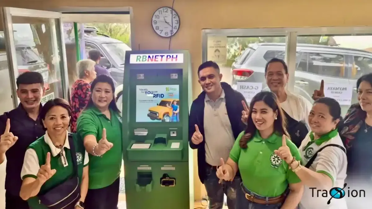 Rural Bank of Escalante staff and Traxion representatives giving a thumbs-up beside the branch's new green Cash Teller Machine.